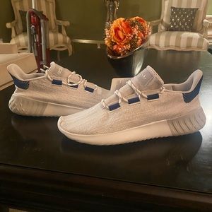 Adidas means athletics shoes size 12.5. Brand new with tags. Light gray.